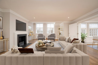 This is an example of a medium sized contemporary living room in London with a wall mounted tv.