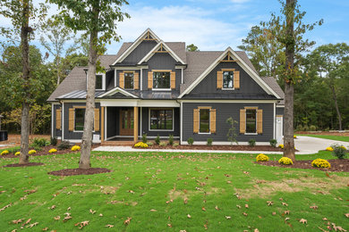 Example of a cottage exterior home design in Raleigh