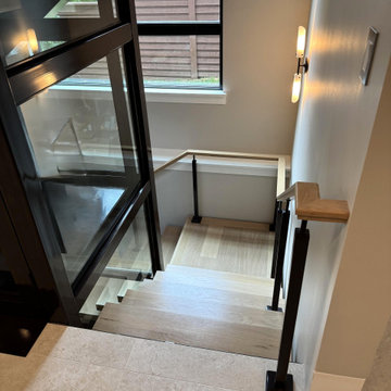 Project #136 | Modern Floating Staircase Encircling Glass Elevator