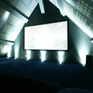 Inspiration for a large contemporary enclosed carpeted home theater remodel in Nantes with gray walls and a projector screen