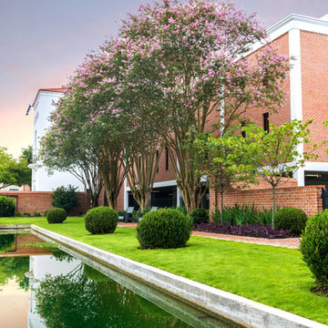 Topiary boxwood and ligustrum help reinforce the rhythms of the garden