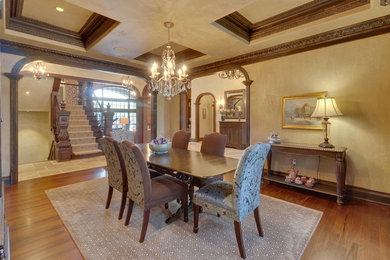 Design ideas for a large traditional separate dining room in Detroit with beige walls, no fireplace, medium hardwood floors and brown floor.