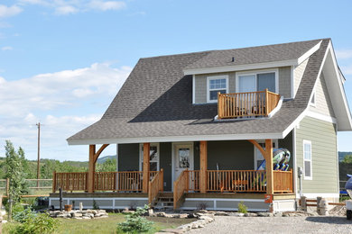 Inspiration for a small craftsman two-story concrete fiberboard gable roof remodel in Calgary