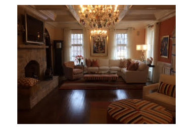 Elegant dark wood floor living room photo in Bridgeport with yellow walls, a standard fireplace, a stone fireplace and a wall-mounted tv