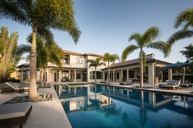 Photo of a mediterranean backyard custom-shaped pool in Orlando.