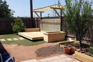 Large elegant backyard patio photo in Austin with decking and no cover