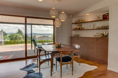 Mid-century modern dining room photo in Portland