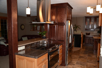 Inspiration for a large timeless u-shaped ceramic tile eat-in kitchen remodel in Other with light wood cabinets, laminate countertops, brown backsplash, stainless steel appliances, two islands, an undermount sink and raised-panel cabinets