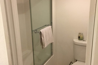 Bathroom - small traditional 3/4 porcelain tile bathroom idea in Los Angeles with a two-piece toilet and white walls