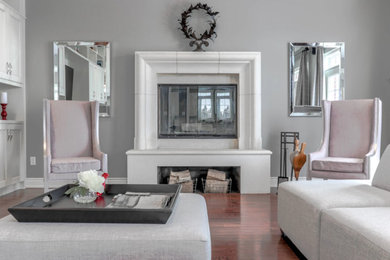 Living room - mid-sized contemporary formal and open concept dark wood floor and brown floor living room idea in Toronto with gray walls, a standard fireplace, a concrete fireplace and no tv