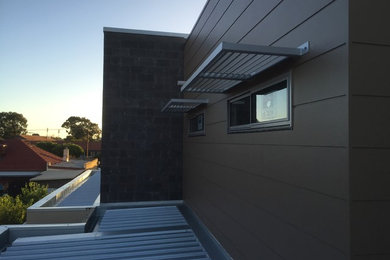 This is an example of a mid-sized contemporary exterior in Adelaide.