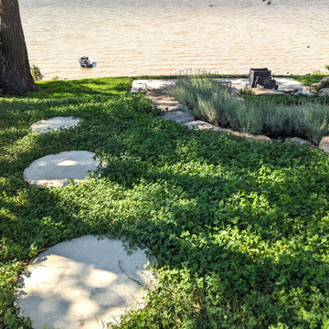 Waterfront backyard landscaping and sunroom extension