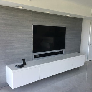 Inspiration for a large contemporary enclosed home cinema in Miami with white walls, marble flooring and a built-in media unit.