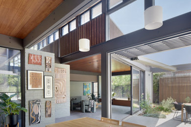 Design ideas for a tropical dining room in Melbourne.