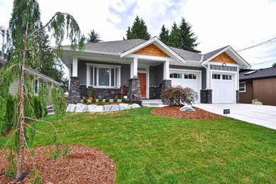 Inspiration for a craftsman gray one-story wood gable roof remodel in Vancouver