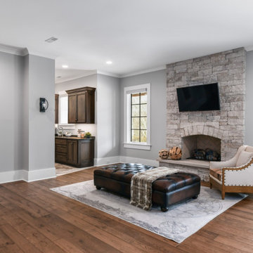 Luxury Modern Farmhouse Lower Level with Stone Fireplaces & Pool Views