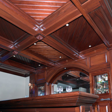 Detail of coffered ceiling in cherry wood home bar