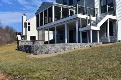 Stamped Concrete with Stone fire pit and stone wall