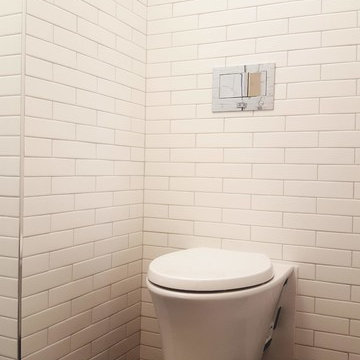 In-wall Kohler dual flush toilet