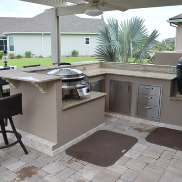 Outdoor Kitchen with pergola, knee wall, Big Green Egg and Evo.