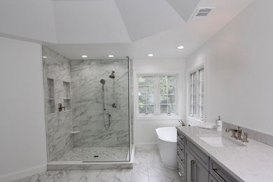 Bathroom - huge traditional master gray tile and ceramic tile ceramic tile, gray floor, double-sink and tray ceiling bathroom idea in Baltimore with shaker cabinets, gray cabinets, a two-piece toilet, gray walls, an undermount sink, quartz countertops, white countertops and a built-in vanity
