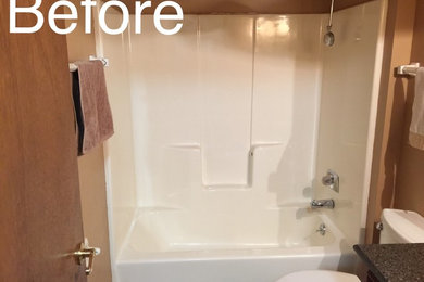 Example of a white tile bathroom design in Milwaukee