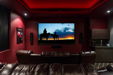 This is an example of a transitional home theatre in Gold Coast - Tweed.