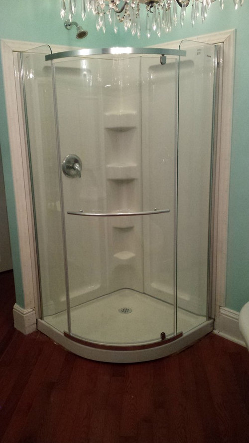 Fill gap between shower base and hardwood floor?