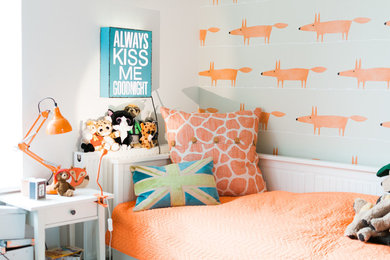 Inspiration for a contemporary gender-neutral kids' bedroom for kids 4-10 years old in Oxfordshire with white walls.