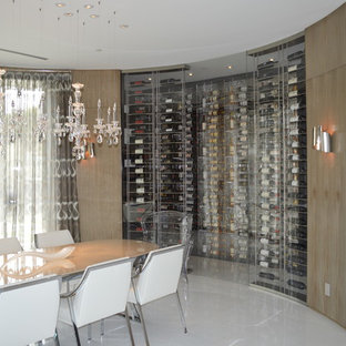 Photo of a medium sized modern wine cellar in Los Angeles with marble flooring and display racks.