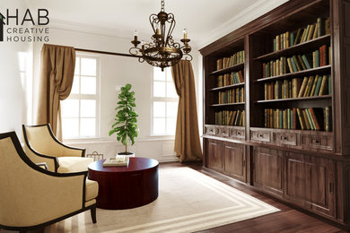 Imagen de biblioteca en casa cerrada actual grande sin chimenea y televisor con paredes blancas, suelo vinílico y suelo marrón