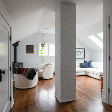Bungalow Attic Conversion Sitting Area with Freestanding Wood Stove | Arlington