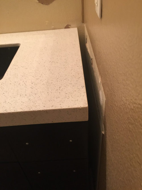 Installed vanity not wide enough. Any ideas without replacing top?