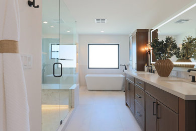 Example of a large transitional master white tile and porcelain tile porcelain tile, beige floor and double-sink bathroom design in Phoenix with shaker cabinets, dark wood cabinets, an undermount sink, quartz countertops, a hinged shower door, white countertops and a built-in vanity