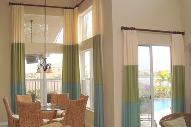 Inspiration for a small tropical porcelain tile great room remodel in Miami with beige walls and no fireplace