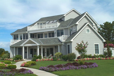 Inspiration for a large transitional gray two-story wood exterior home remodel in Philadelphia