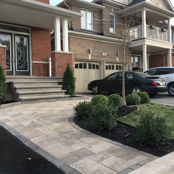 Front Landscaping with Interlocking Walkway, Flower Beds and Natural Stone Steps
