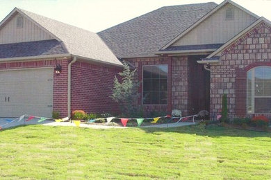 Inspiration for a craftsman one-story brick exterior home remodel in Other