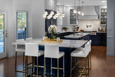 Inspiration for a transitional kitchen remodel in Other with a single-bowl sink, shaker cabinets, quartz countertops, white backsplash, subway tile backsplash, two islands and white countertops