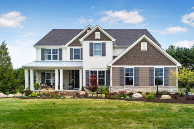Large elegant two-story mixed siding house exterior photo in Columbus
