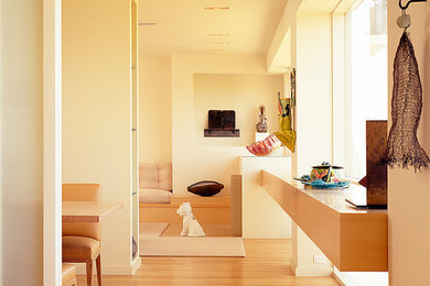 Inspiration for a large modern formal and open concept light wood floor and orange floor living room remodel in San Francisco with beige walls