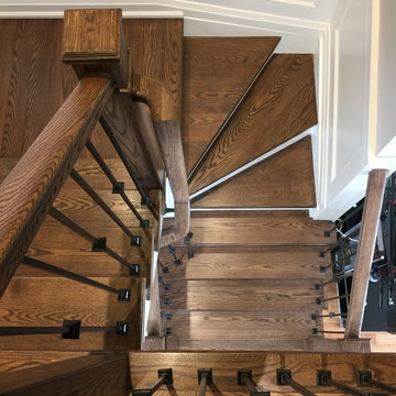 Espresso Stained Oak Staircase w/ Wainscoting, doors & trim