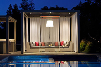 Photo of a large contemporary backyard stone landscaping in San Francisco.
