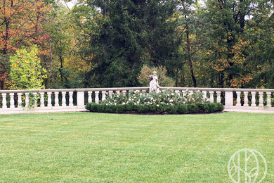This is an example of a huge french country backyard stone landscaping in Cincinnati for summer.