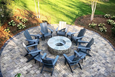 Design ideas for a large backyard patio in Birmingham with a fire feature and concrete pavers.