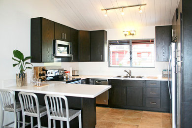 Example of a trendy home design design in Hawaii