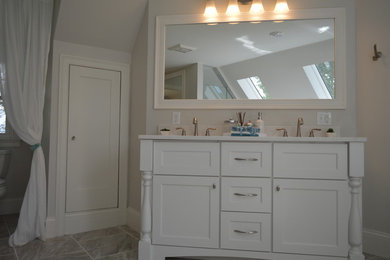 Mid-sized transitional master beige tile and cement tile bathroom photo in Boston with dark wood cabinets, a hot tub, an undermount sink, beige countertops, recessed-panel cabinets, beige walls and quartzite countertops
