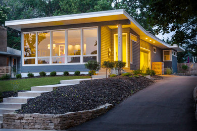 Mid-sized contemporary gray one-story concrete fiberboard flat roof idea in Minneapolis