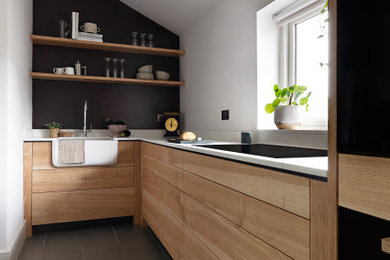 Inspiration for a small contemporary kitchen in Other with composite countertops.