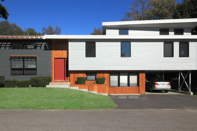 Inspiration for a mid-sized contemporary split-level exterior in Boston with wood siding.